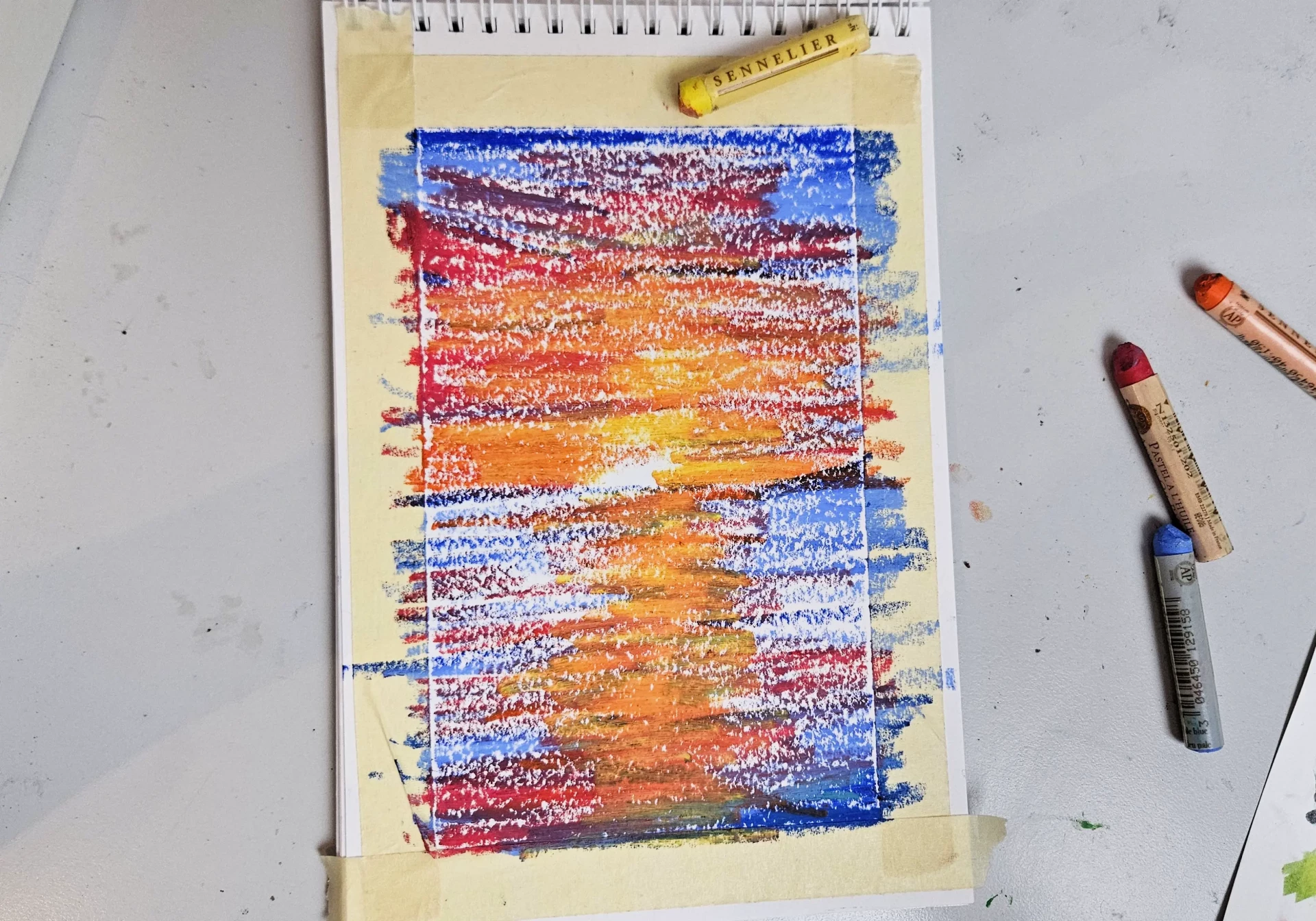 dessiner les détails d’un coucher de soleil aux pastels à l’huile